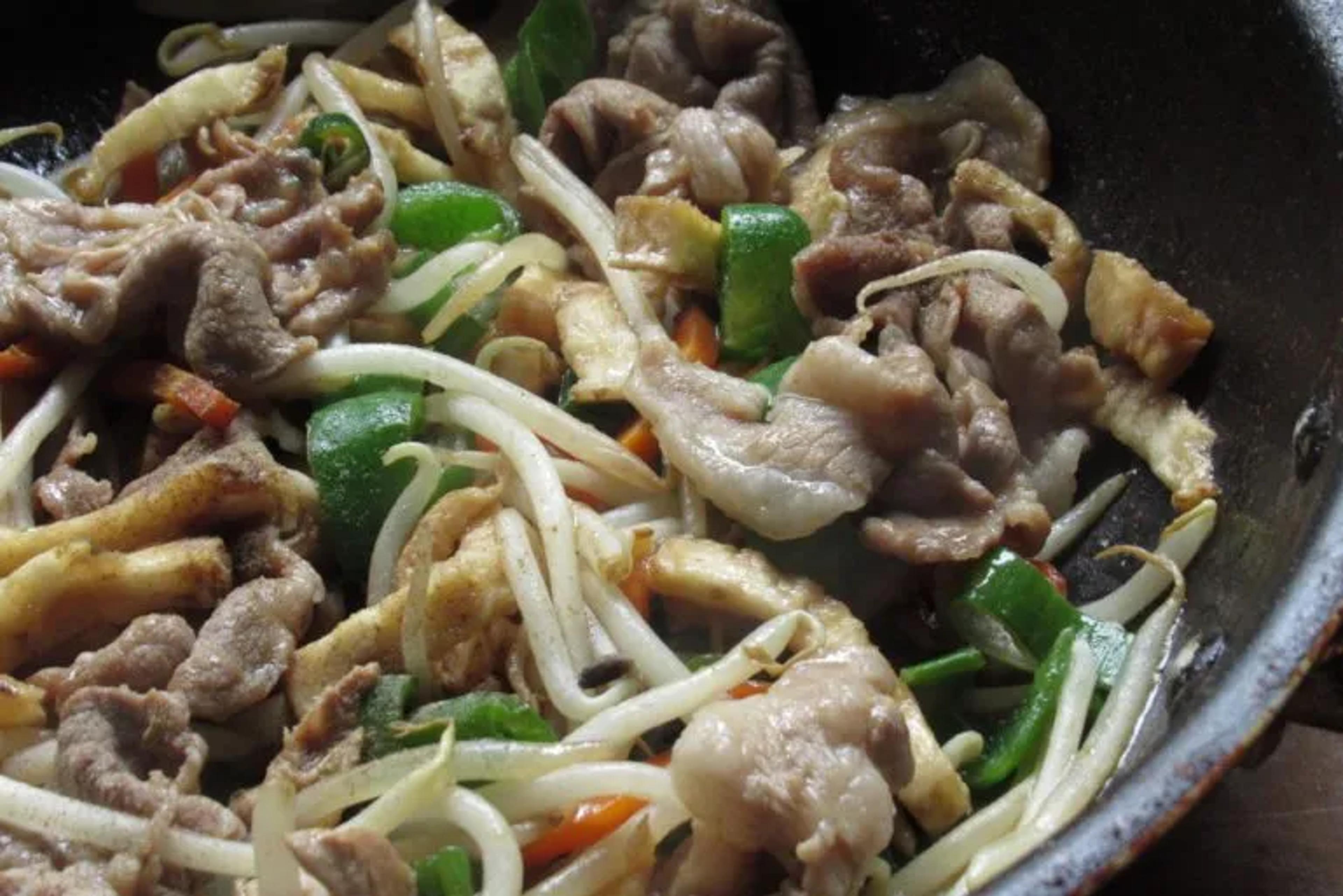 stir-frying meat and vegetables