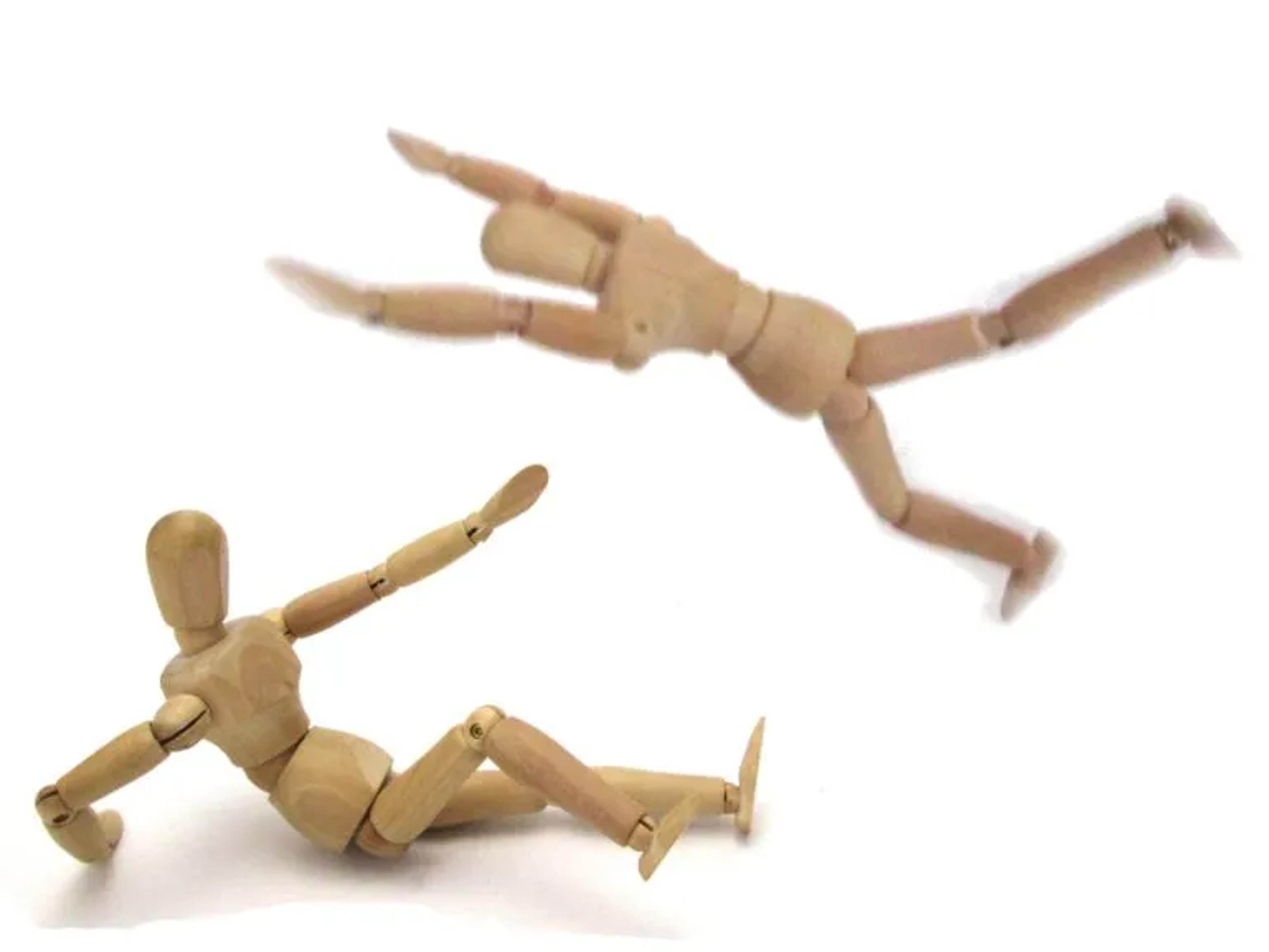 Wood man jumping at another woodman