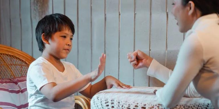 Mother and son playing janken