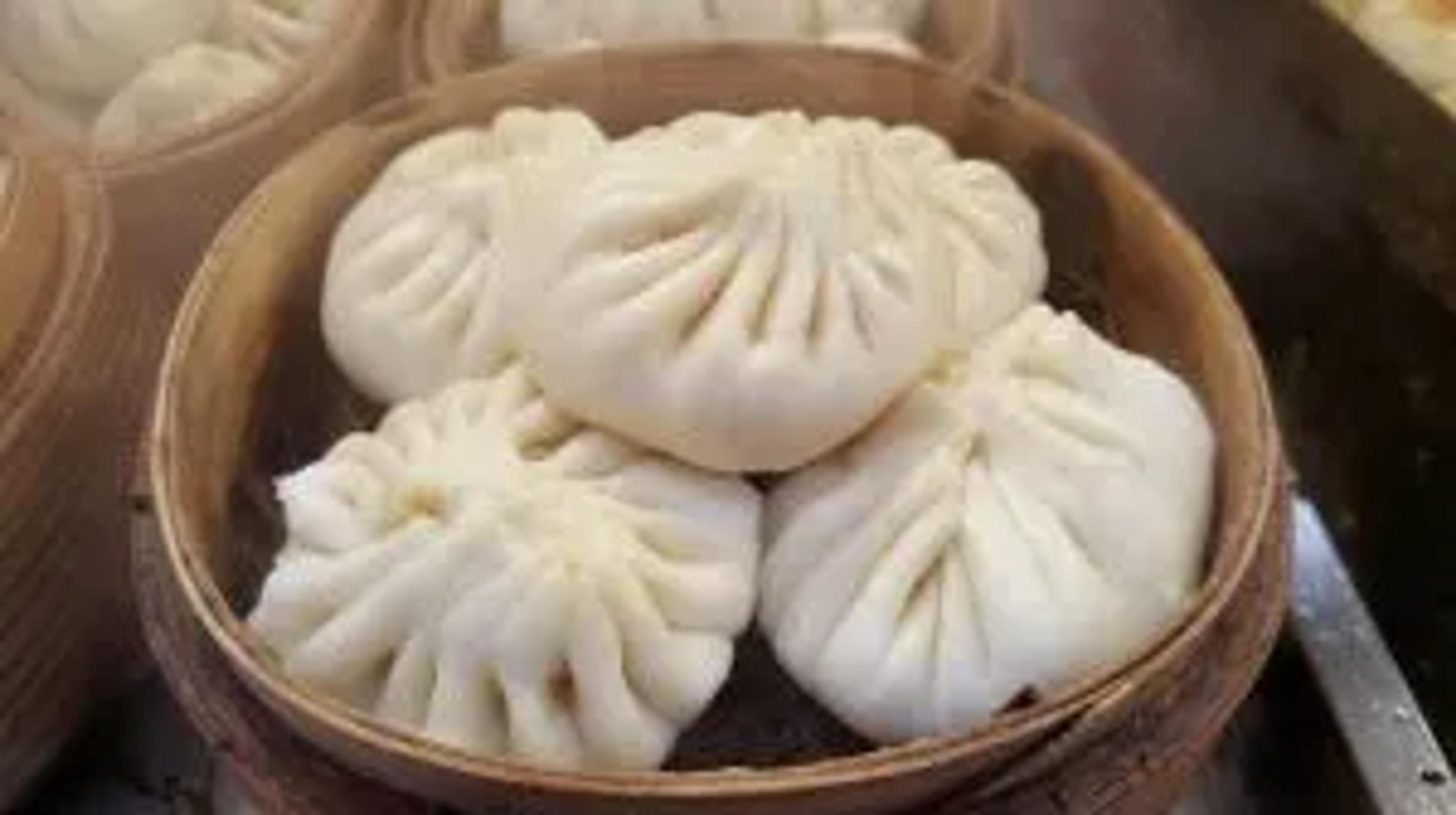 steamed stuffed buns in a bamboo steamer