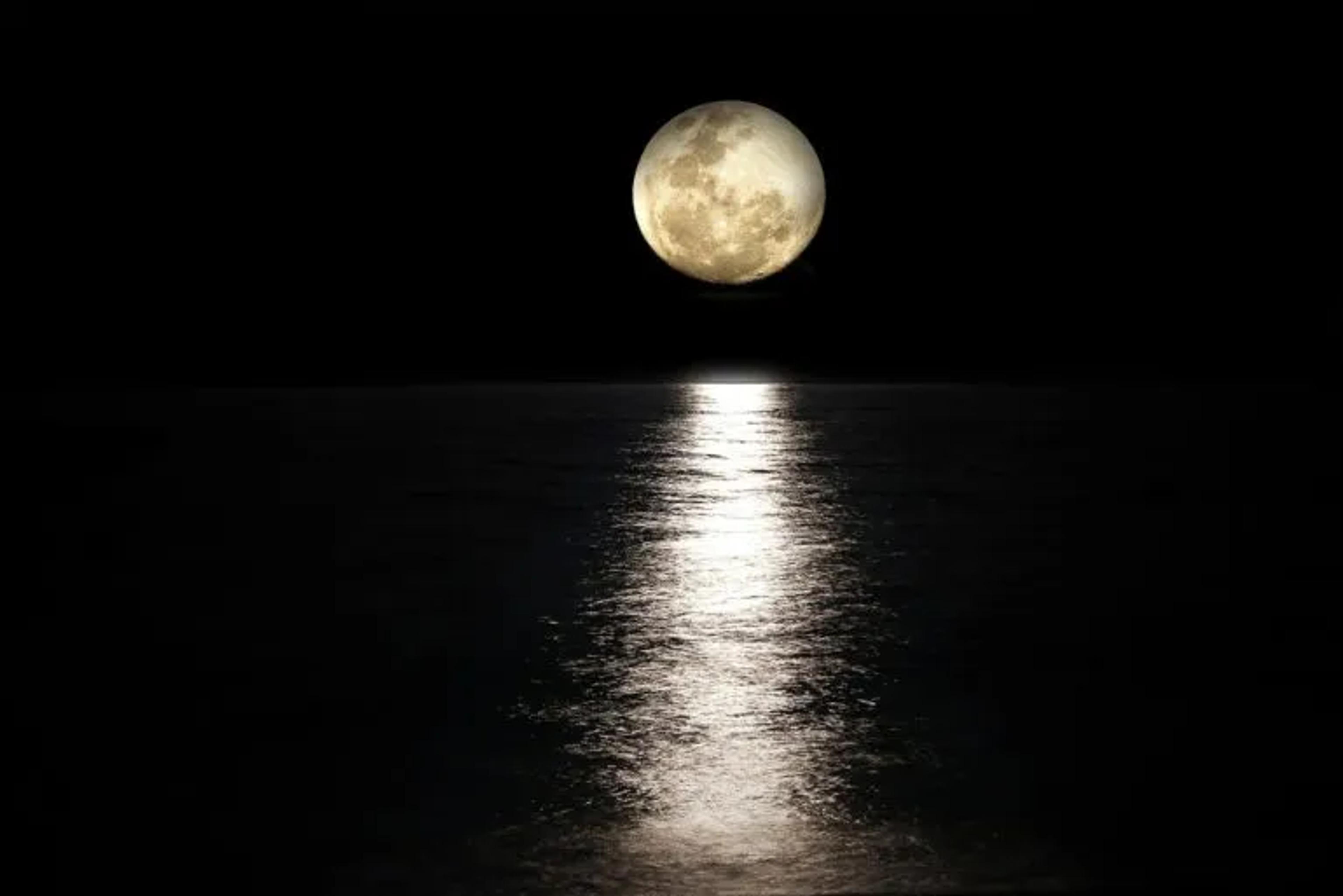 image of moon over water