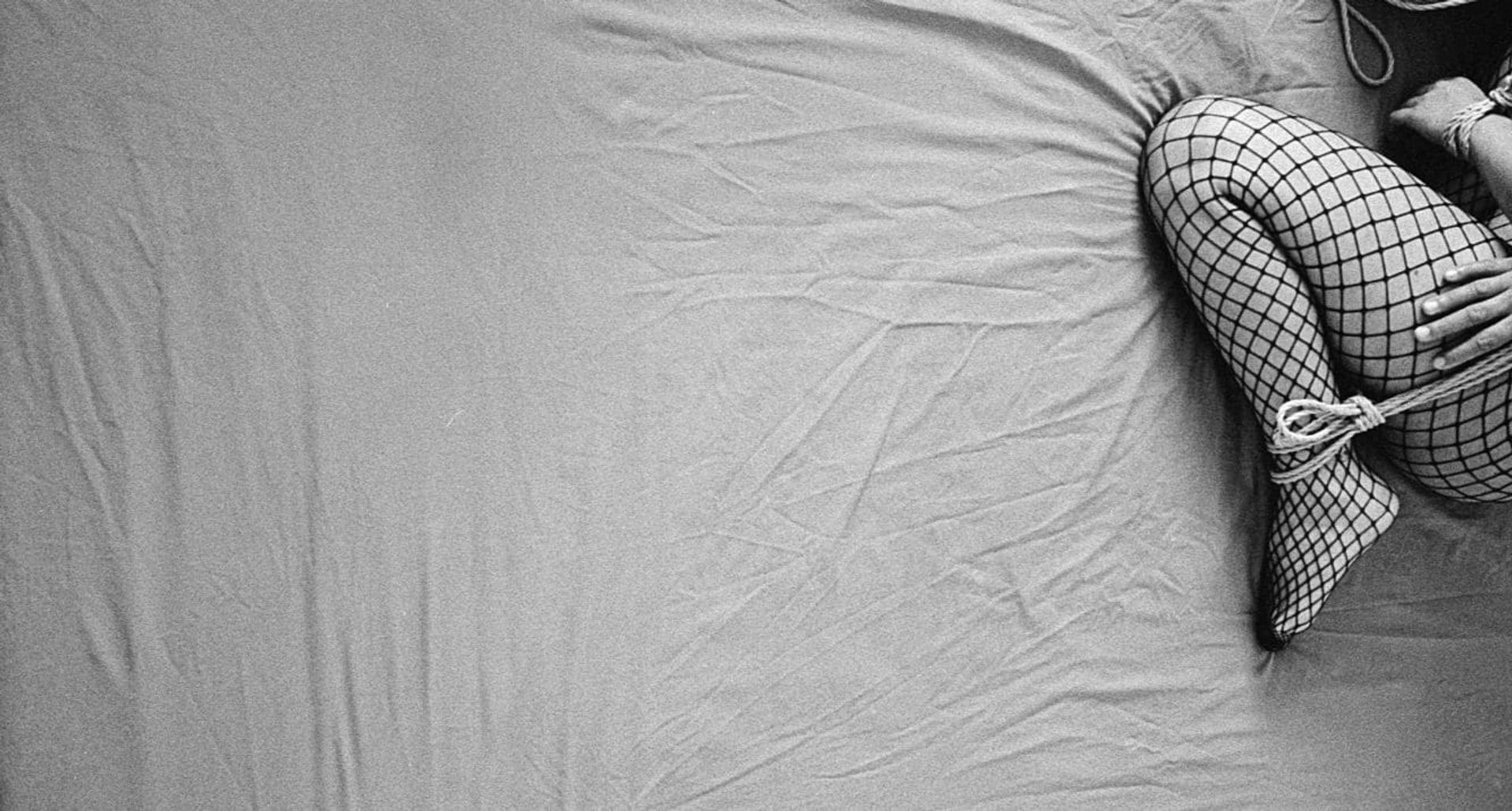Black-and-white kinbaku scene