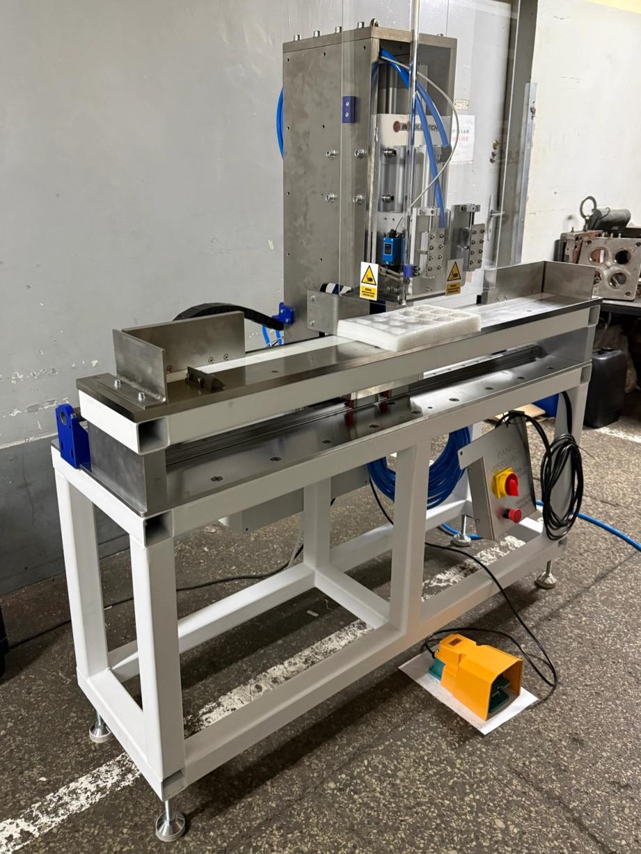 A specialised pneumatic press with a movable head, designed for marking short production runs.
