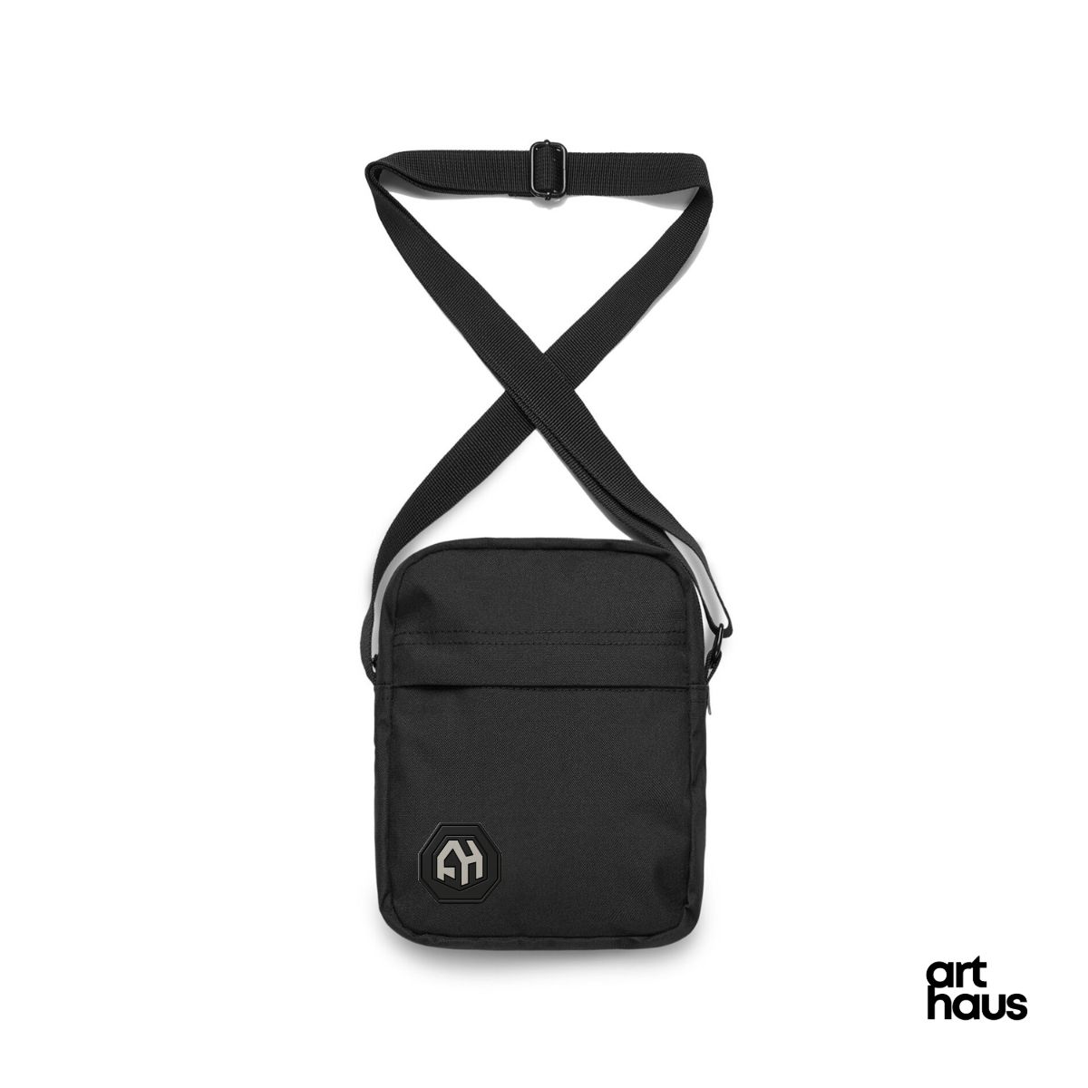 Black Art Haus crossbody bag with adjustable strap and octagonal AH logo patch.