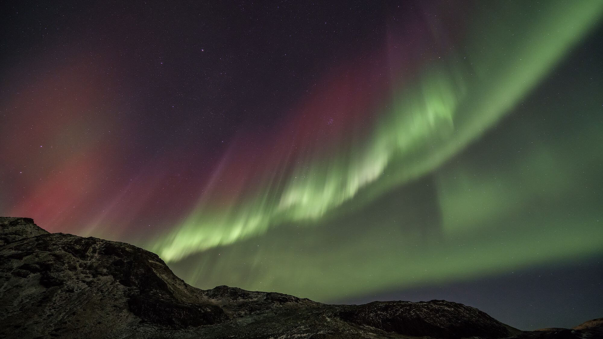 The northern lights illuminating landscape in January