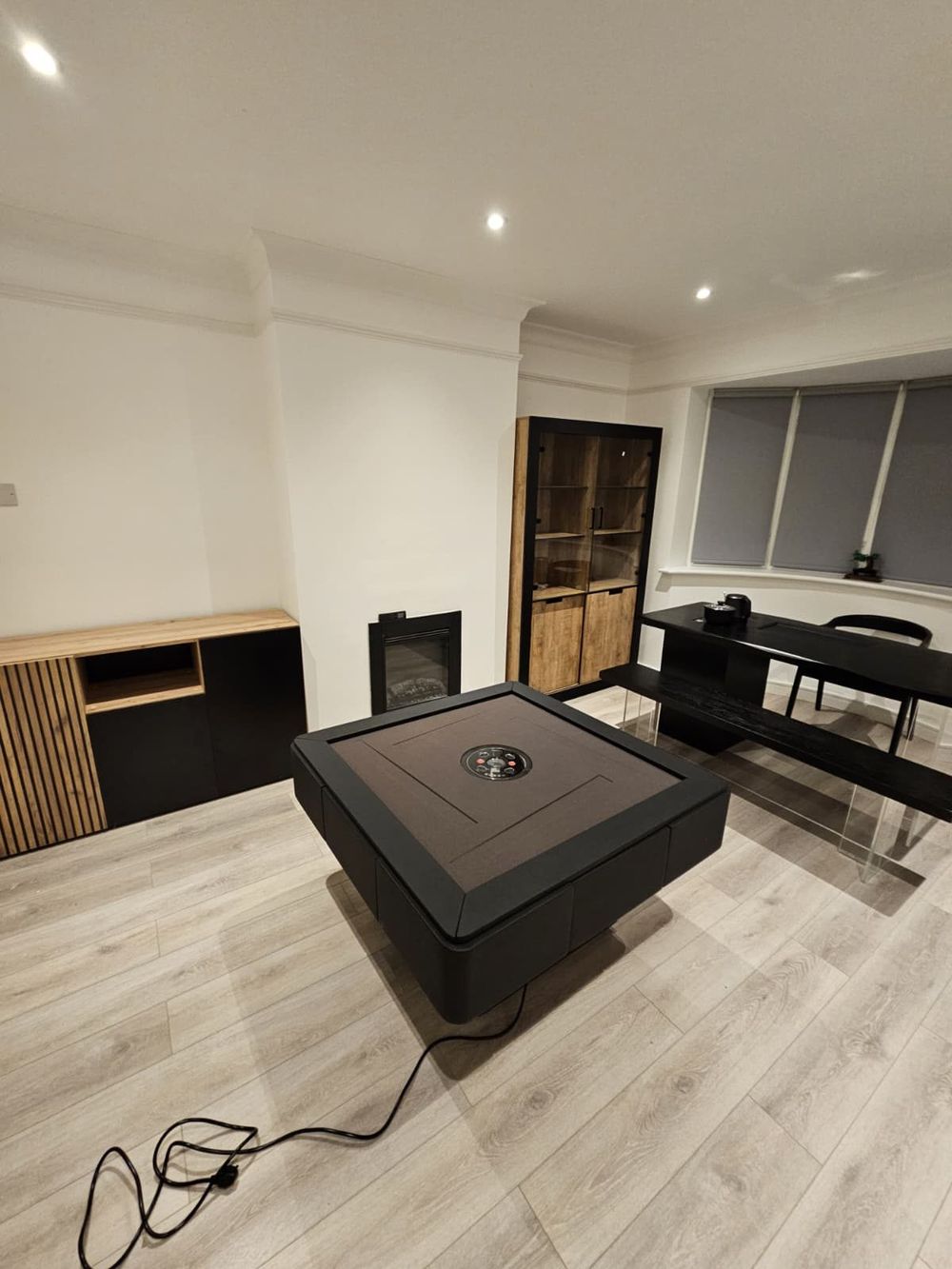 Gaming table, fireplace and bespoke joinery — Entertainment Room by TrustBuilt Projects