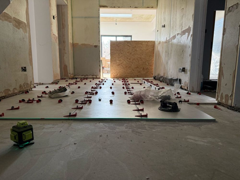 During — large format tiling in progress — Hallway Transform by TrustBuilt Projects
