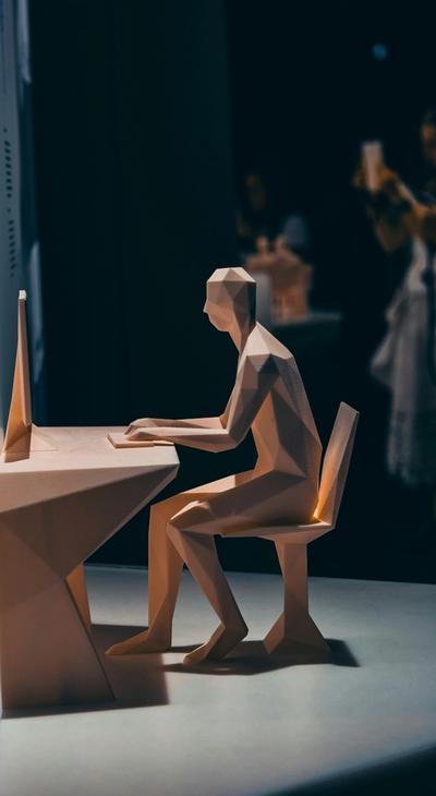 Model sitting at desk