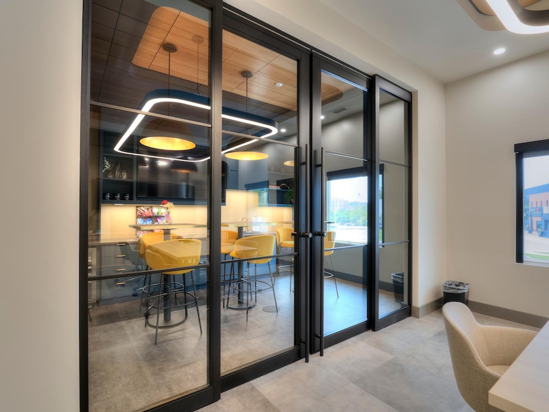 ThinWall aluminum door system installation showing frameless design