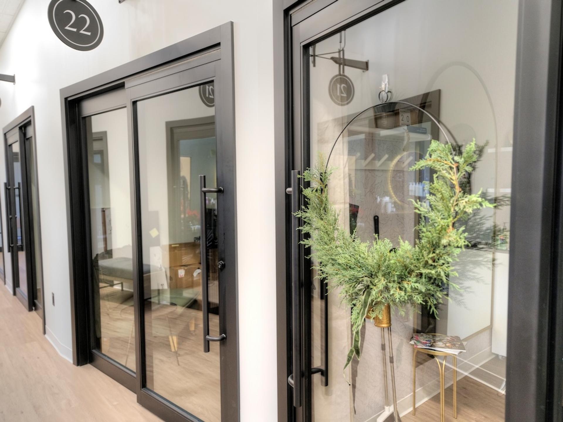 Trimmed aluminum door system installation showing snap-trim design