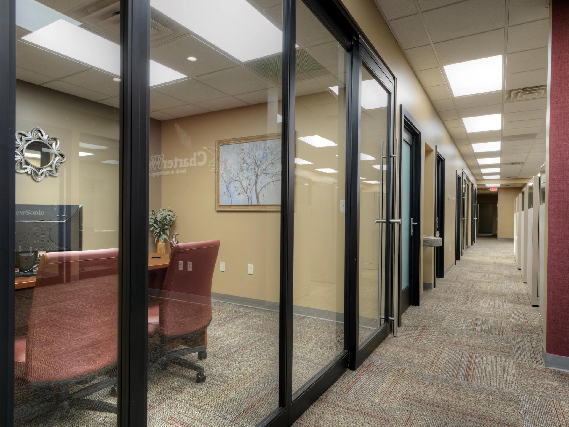 Aluminum sliding door installation at CharterWest Bank by Darland Construction