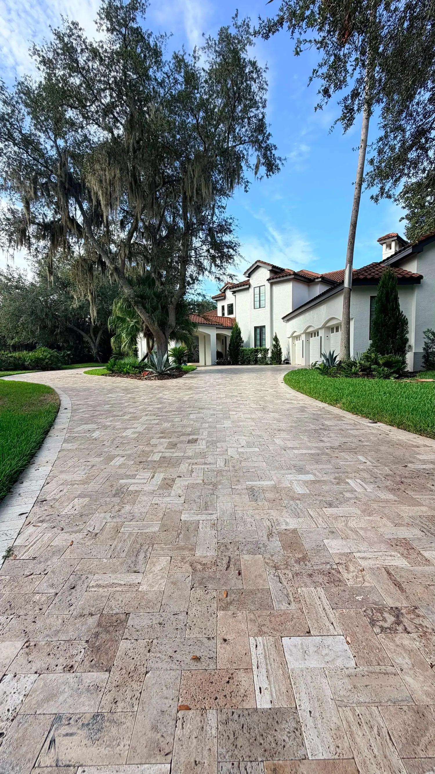 Paver driveway leading to a luxury residential home in Orlando, FL
