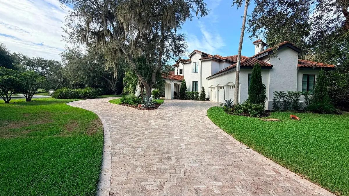 Curved brick paver driveway installed at a residential property in Orlando