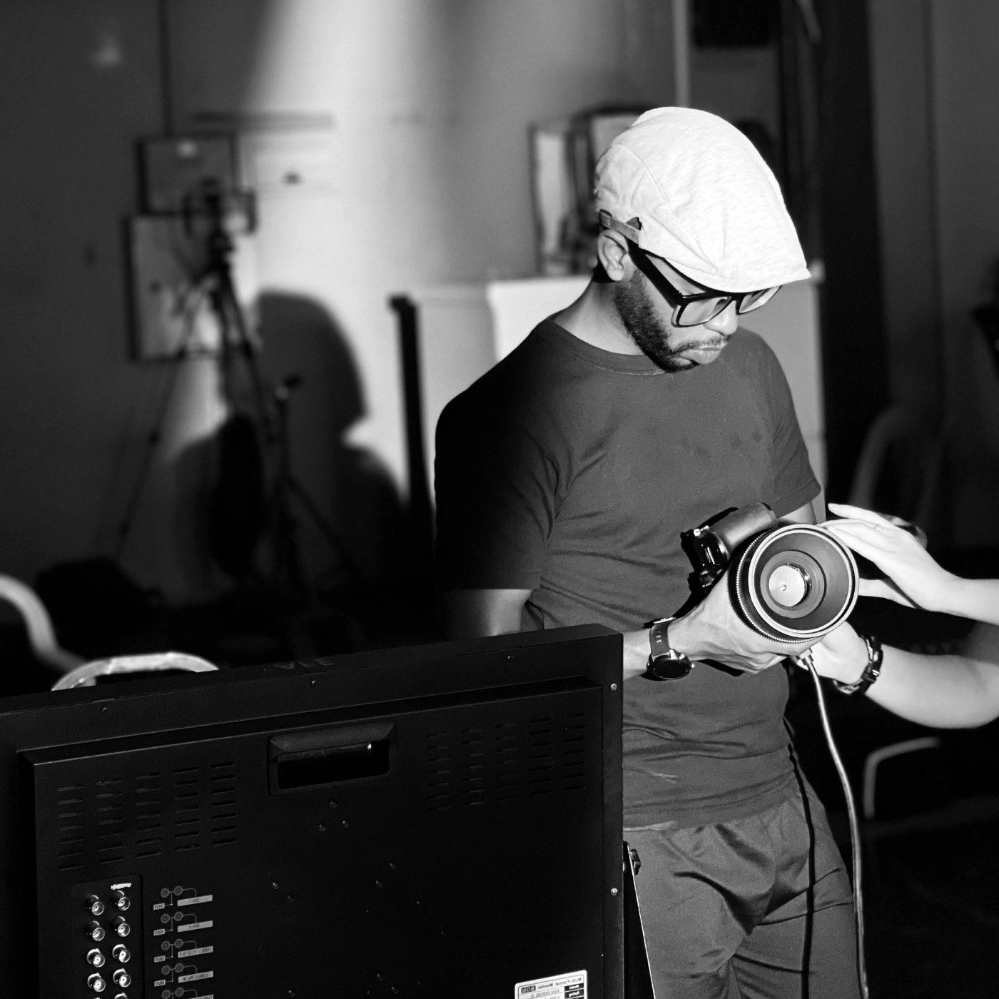 Al Amin working behind the camera on a film set