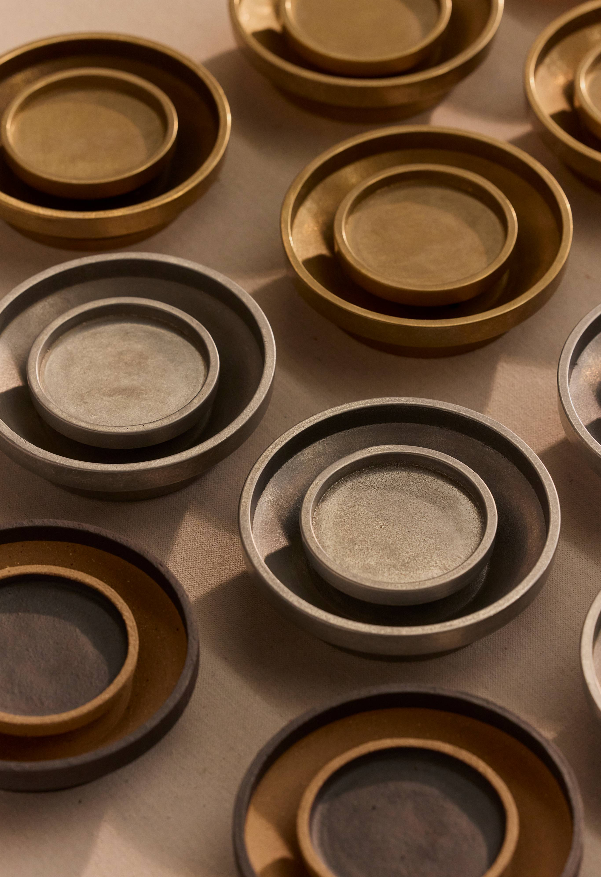 Chorus Wall Lights in Aluminium and Brass, clustered together.