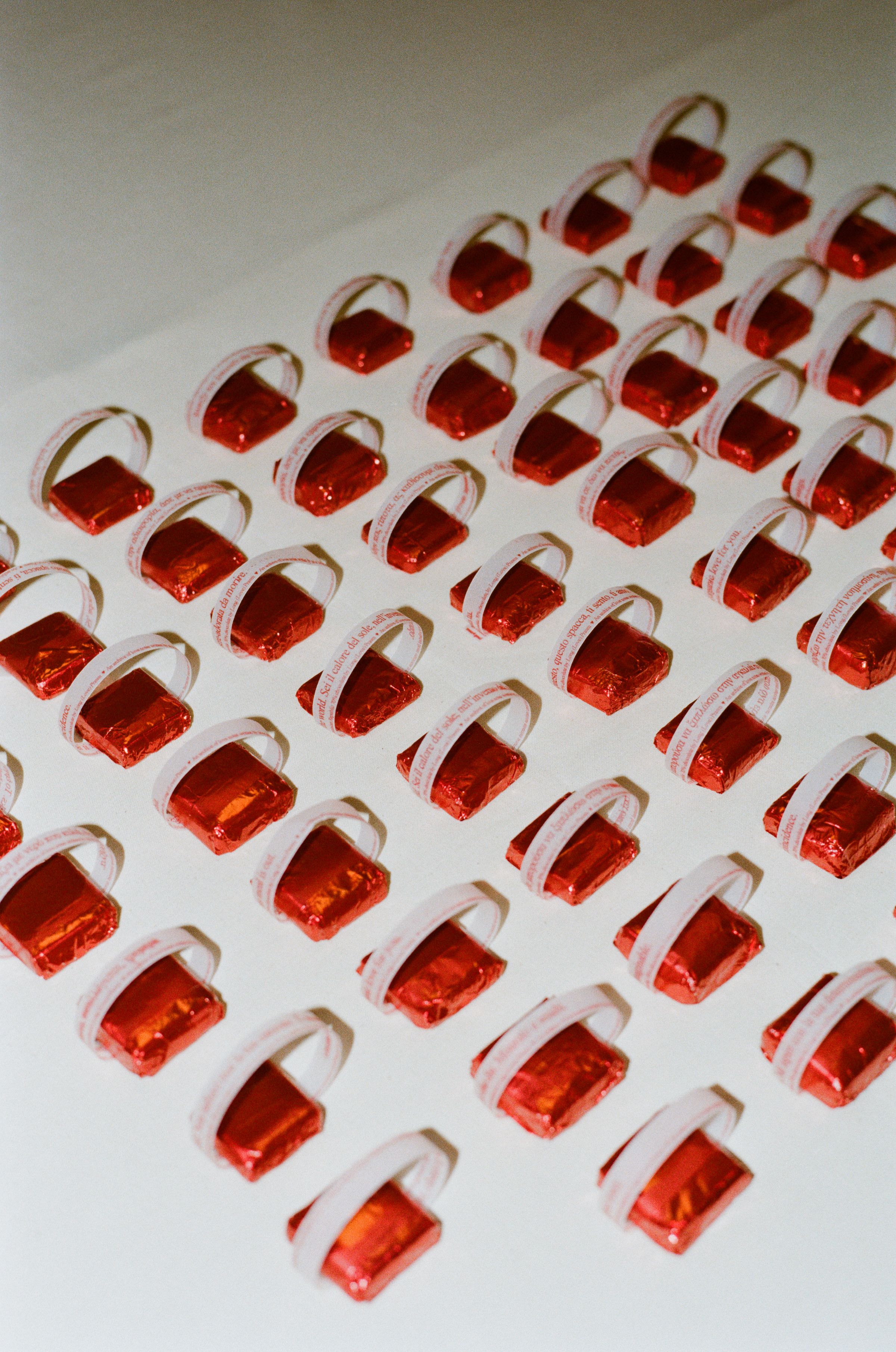 Custom chocolates by Long Prawn, with a cheeky note on a table.
