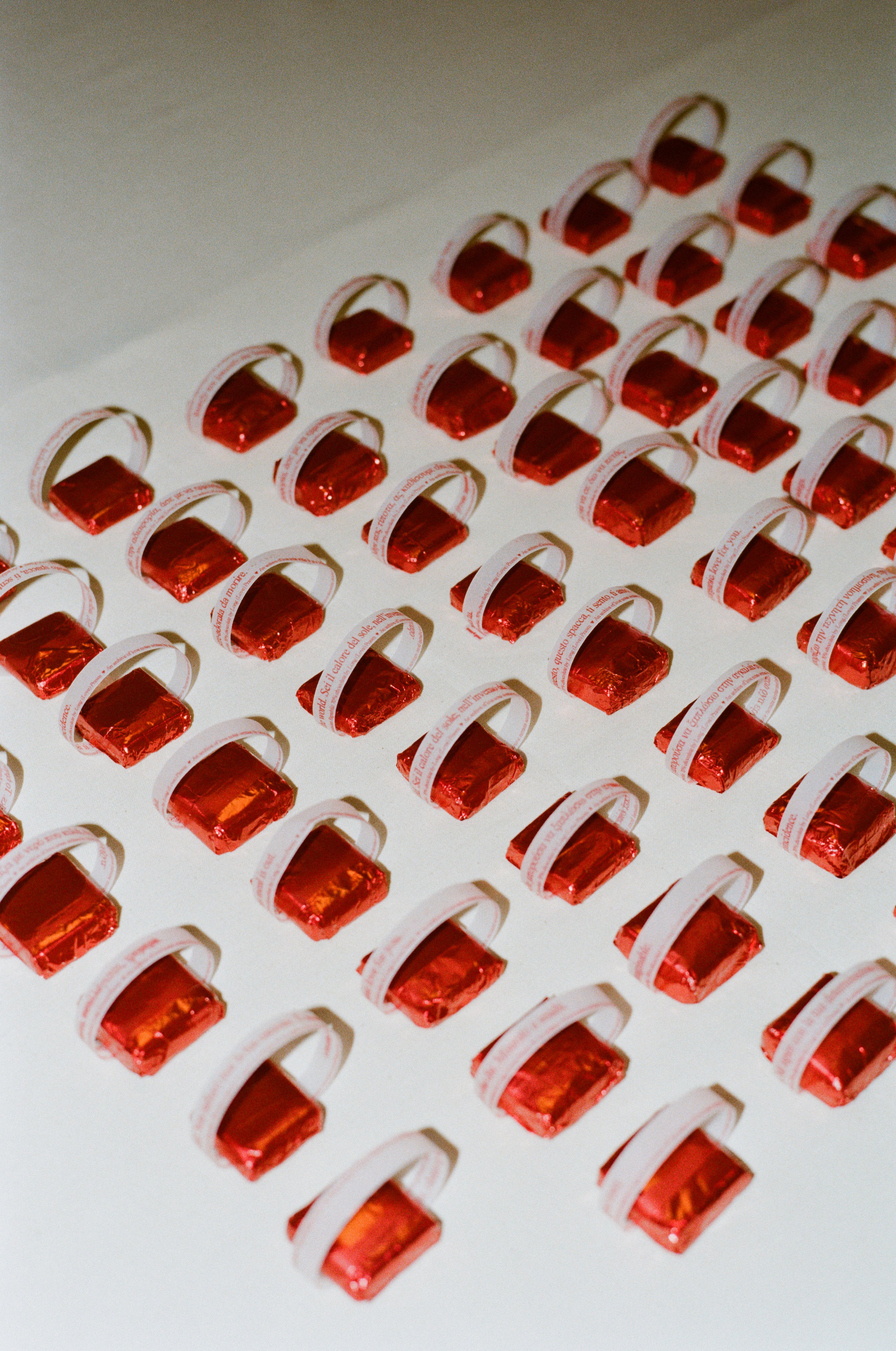 Custom chocolates by Long Prawn, with a cheeky note on a table.