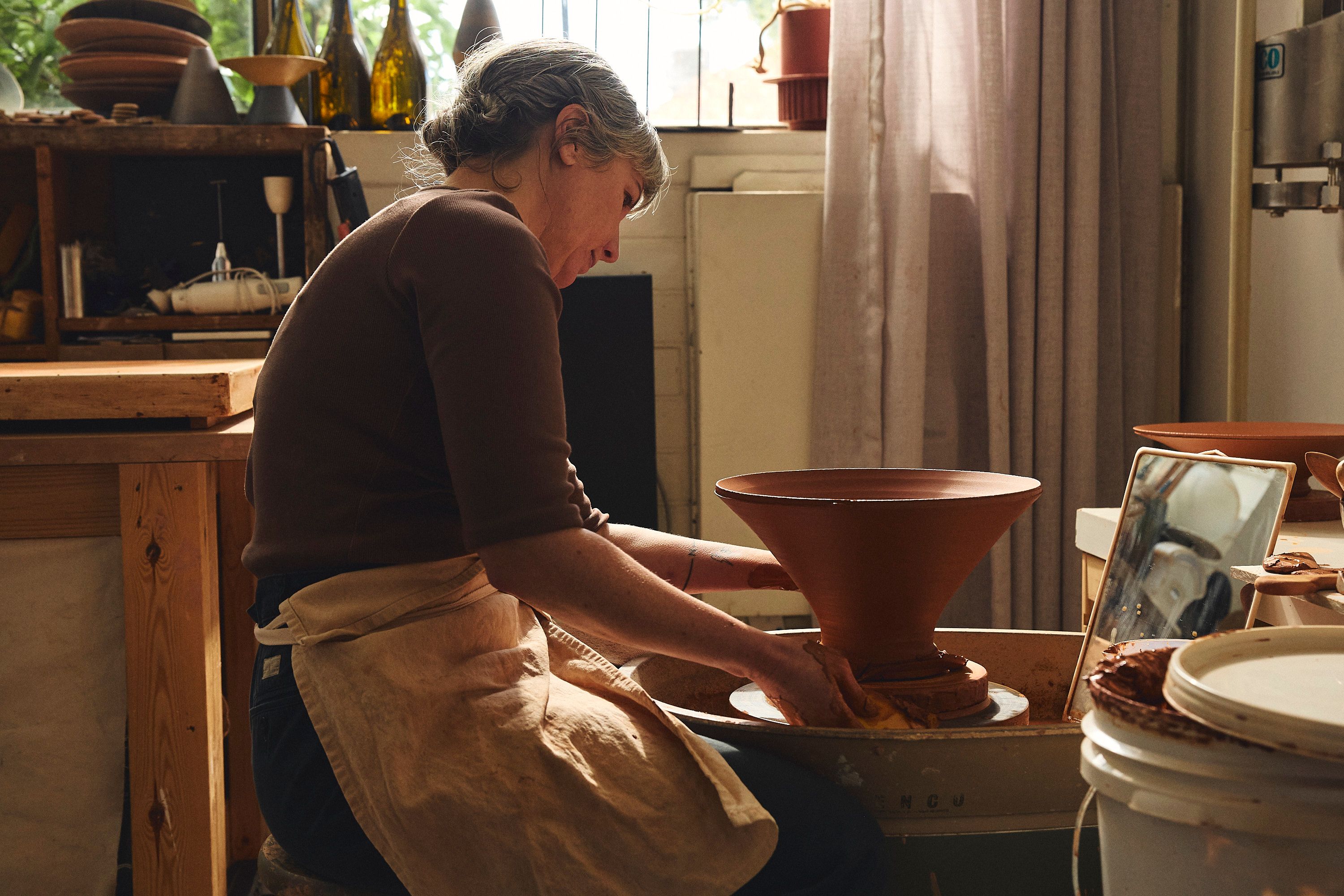 Belinda Wiltshire kneading clay in her Preston studio