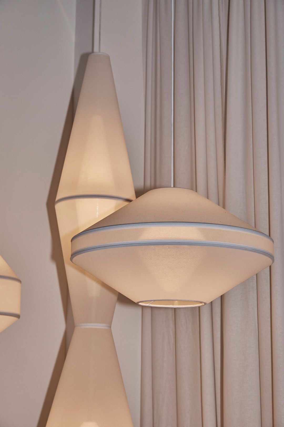 A Sequence 01 Table in stainless steel in a dark, moody room.