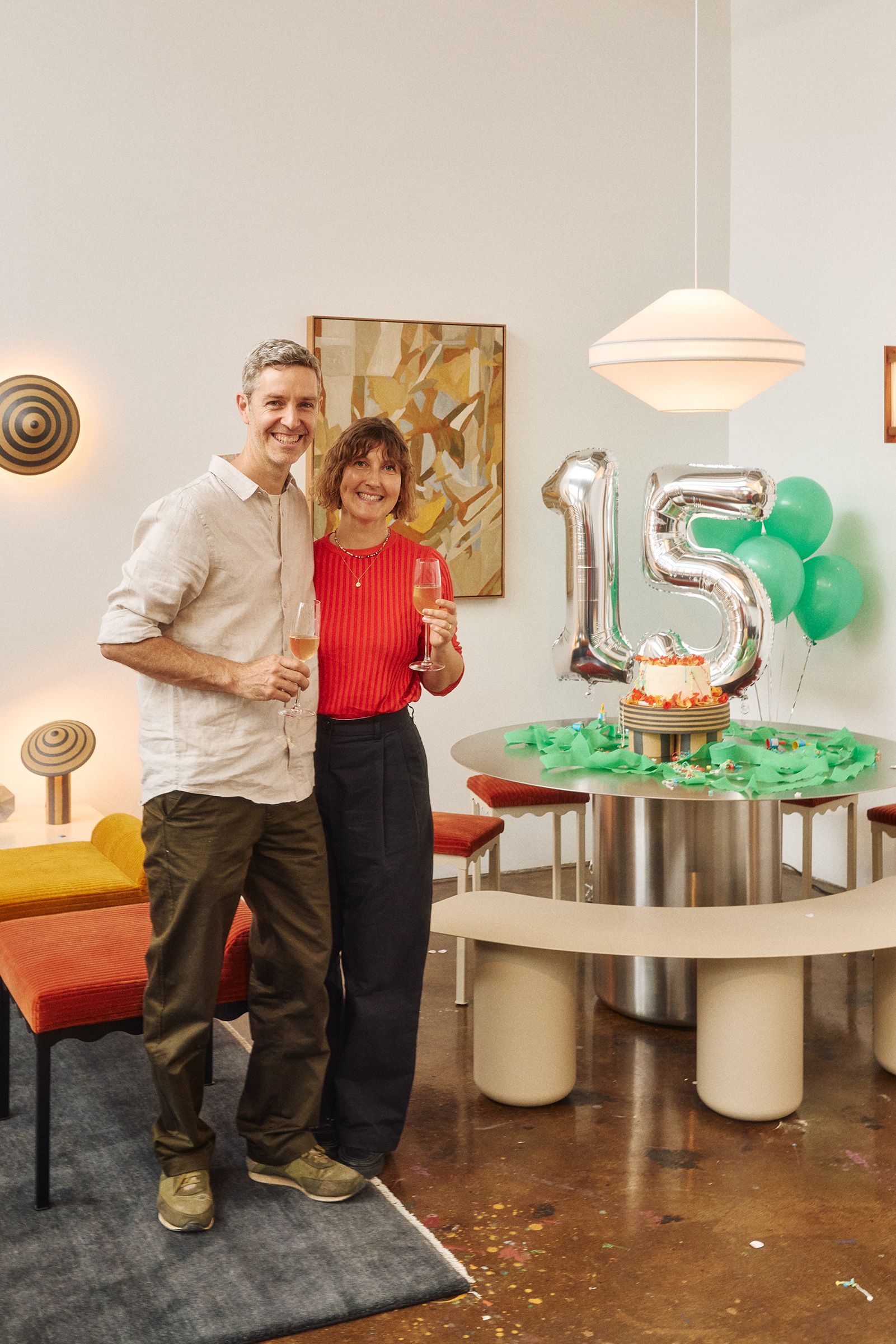 Kate and Haslett celebrating 15 years of Coco Flip in the showroom