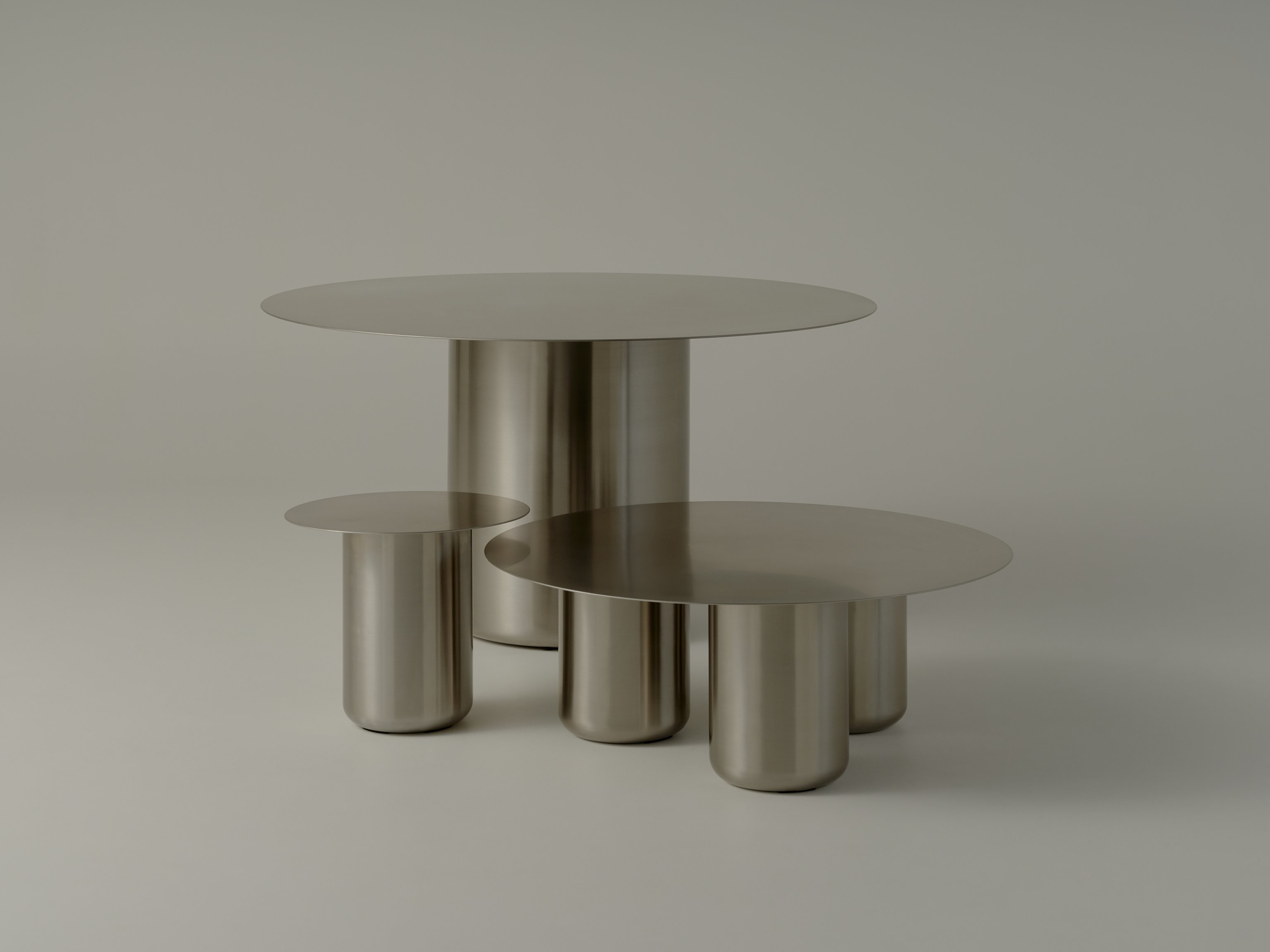 Stainless Steel Dining Table and Coffee Tables with chunky legs and a slender top
