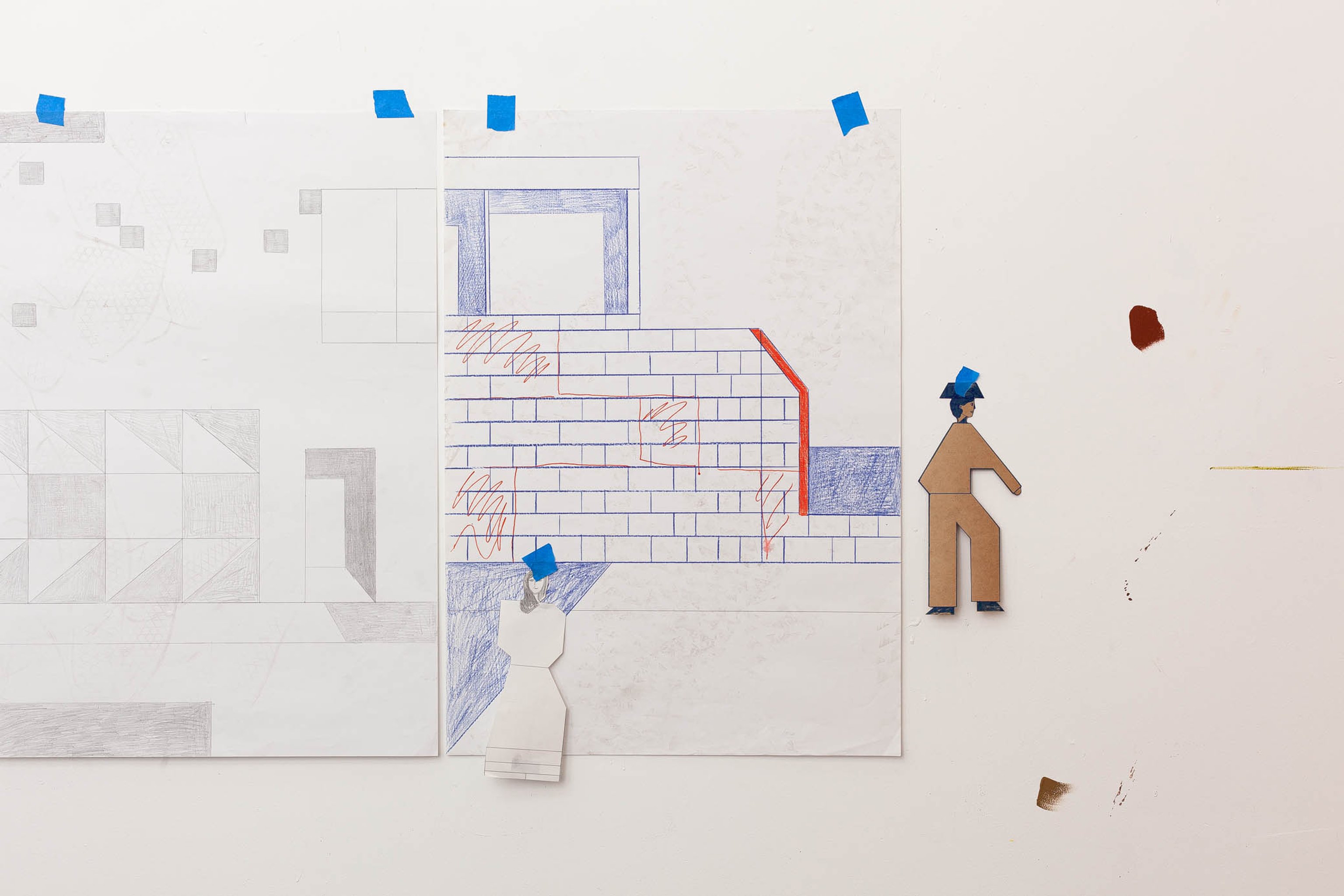 Sketches by Mark Alsweiler taped with painters tape on a white wall