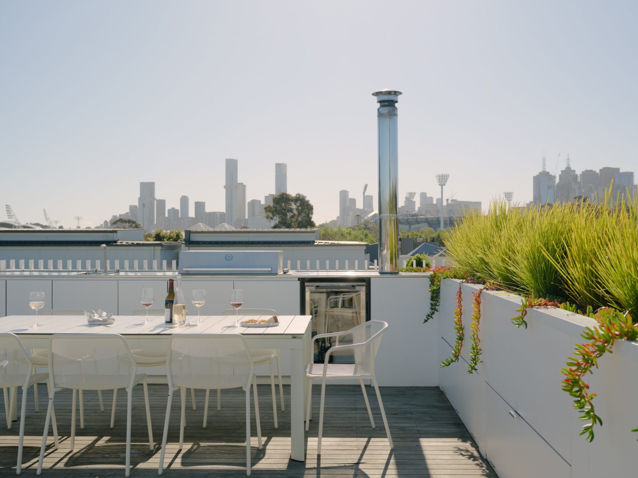 A view of Melbourne's skyline from a private rooftop terrace