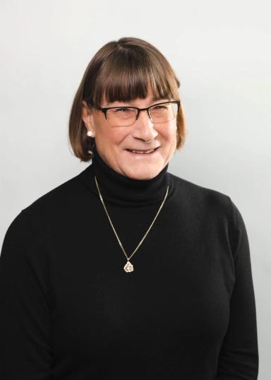 Janice Resch headshot on a white backdrop