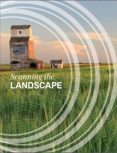 Text reading "Scanning the Landscape" with a grain elevator in the background