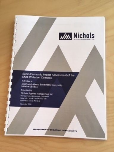 A report with text reading "Nichols Applied Management Inc: Socio-Economic Impact Assessment of the Shell Waterton Complex"