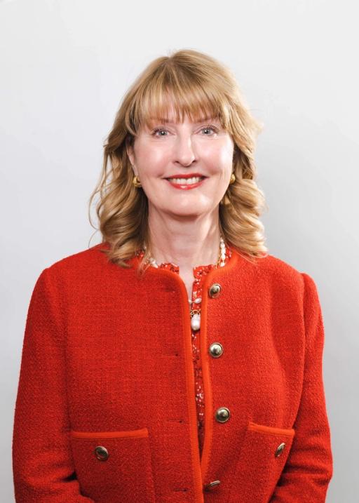 Penny Omell headshot on a white backdrop