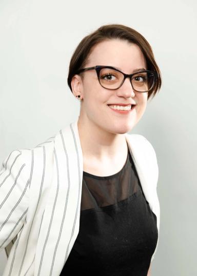 Sarah Stuebing headshot on a white backdrop