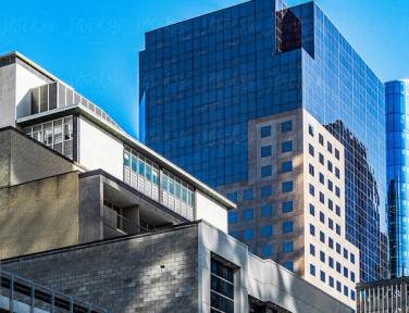 A tall blue building with a Stocksy watermark overlaying the image.