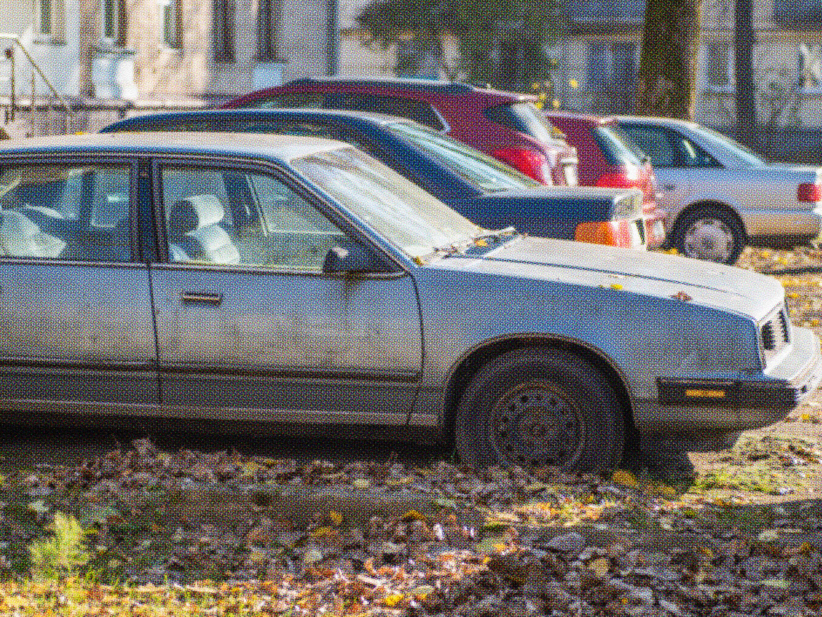 old blue car sitting in driveway