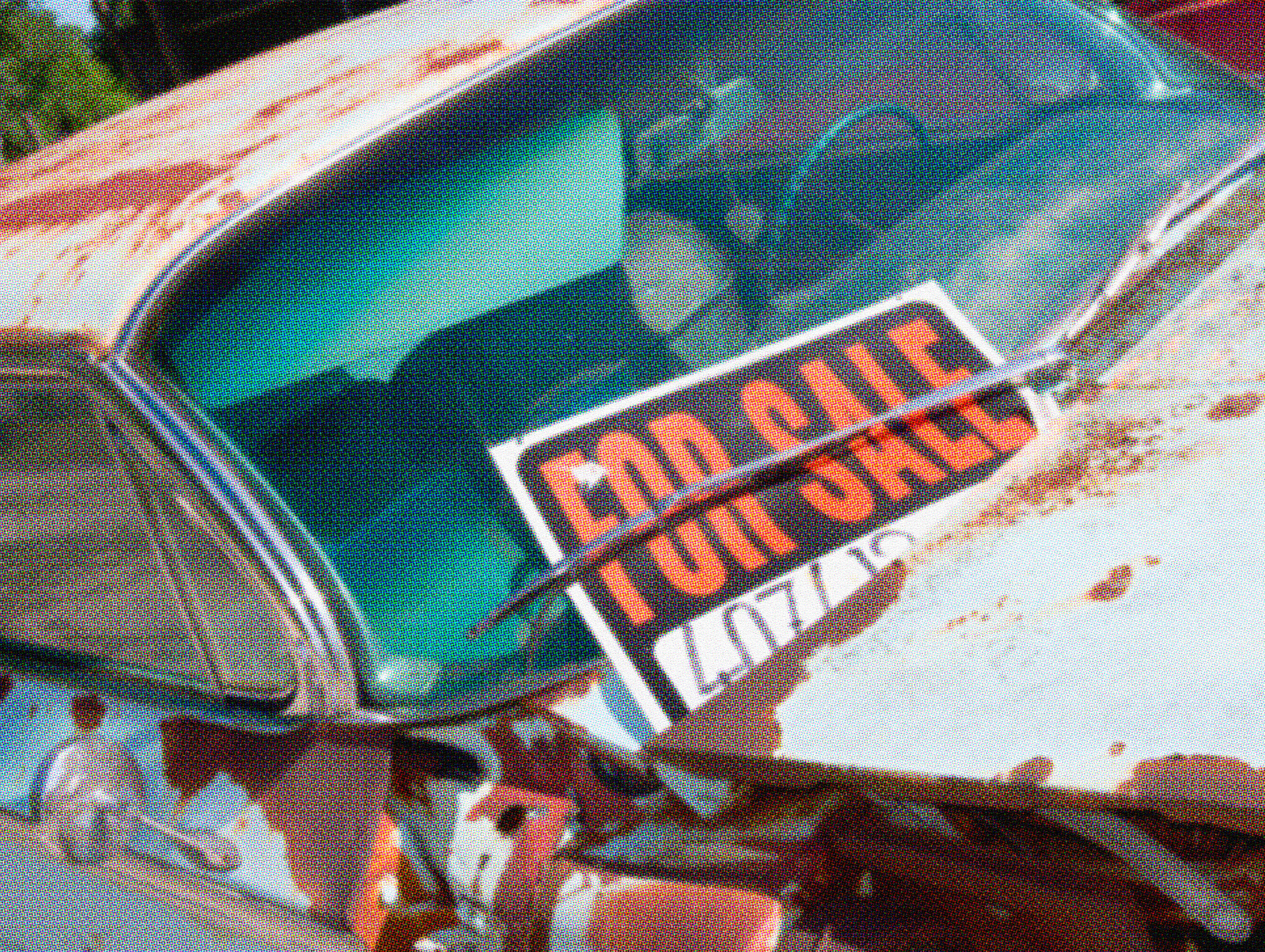 Close-up of a "Car For Sale" sign displayed on a car windshield with a contact phone number