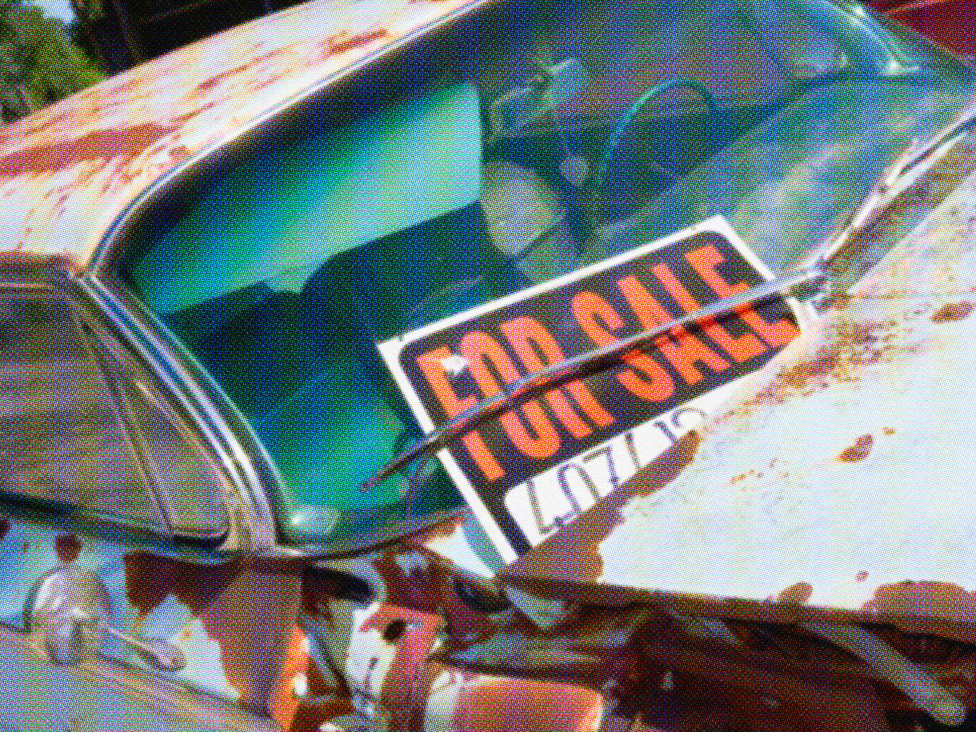 Close-up of a "Car For Sale" sign displayed on a car windshield with a contact phone number