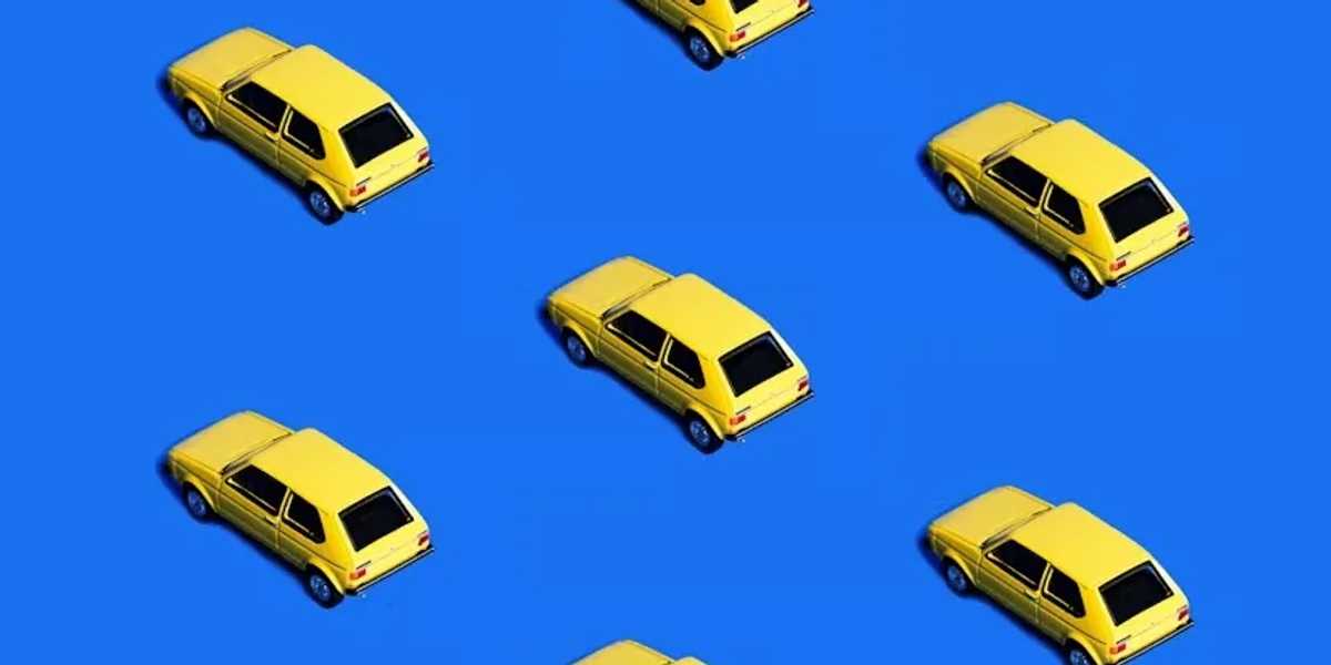 Repeating yellow cars on a blue background.