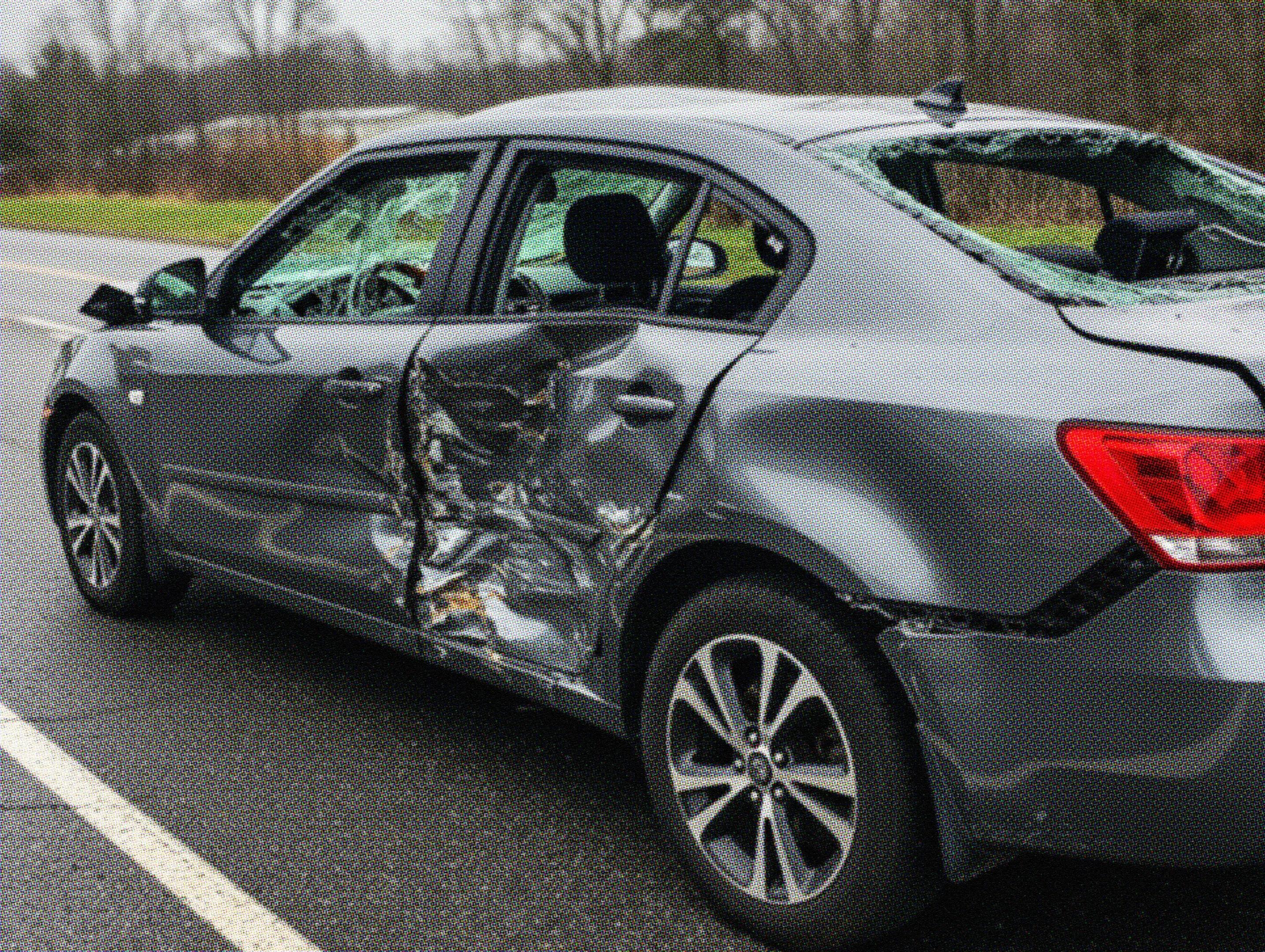 Damaged car with smashed side and broken windows after an accident.