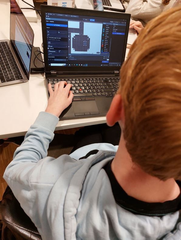 Students teaching GDevelop.