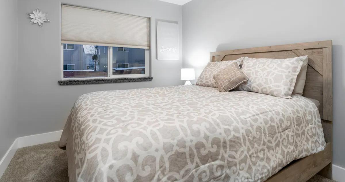 compact bedroom designed for comfort and secure rest in rental property