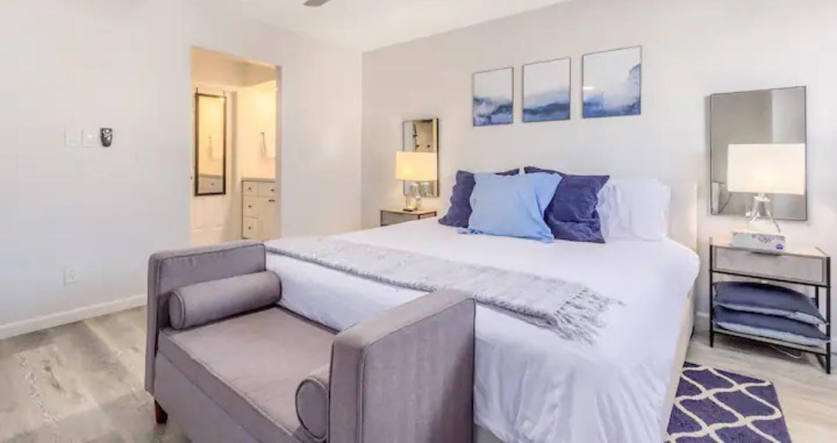 comfortable blue themed bedroom in furnished rental supporting rest for military guests