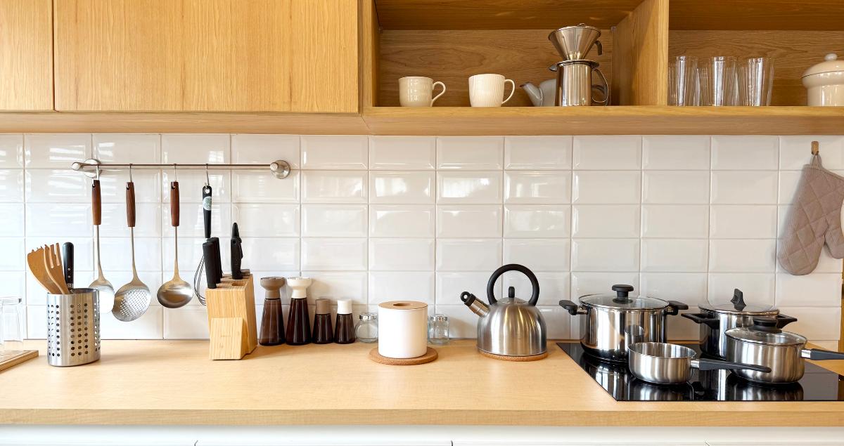 Fully equipped kitchen with utensils in a furnished TDY rental home suitable for military guests