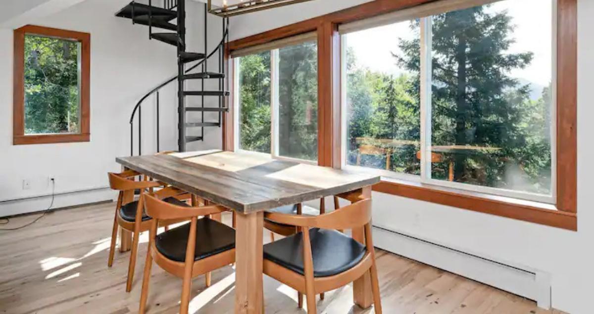 sunlit dining area with large windows in short term rental for TDY guests