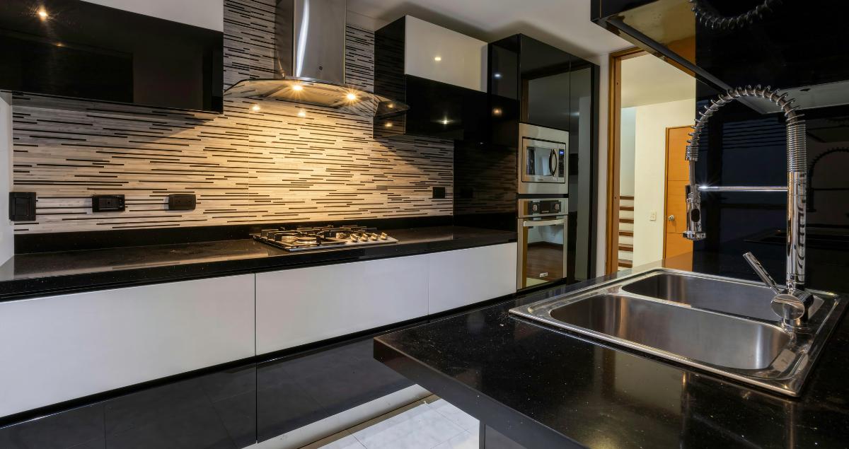 Modern black kitchen in a TDY rental near Eglin AFB, perfect for military personnel
