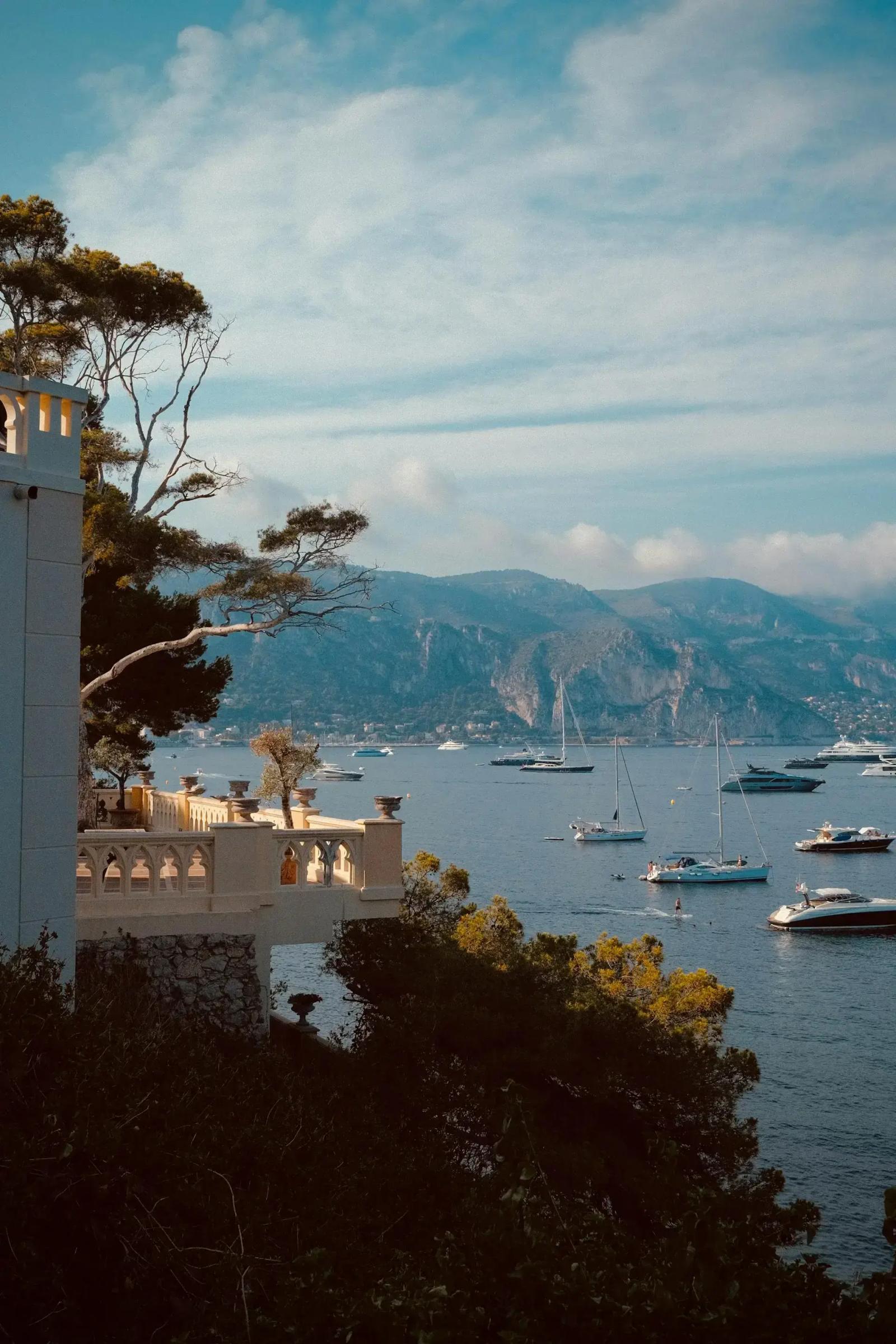 Scenic Cap Ferrat in France with balcony and boats in the bay