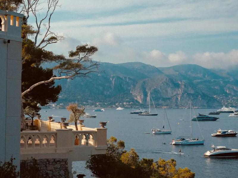 Scenic Cap Ferrat in France with balcony and boats in the bay