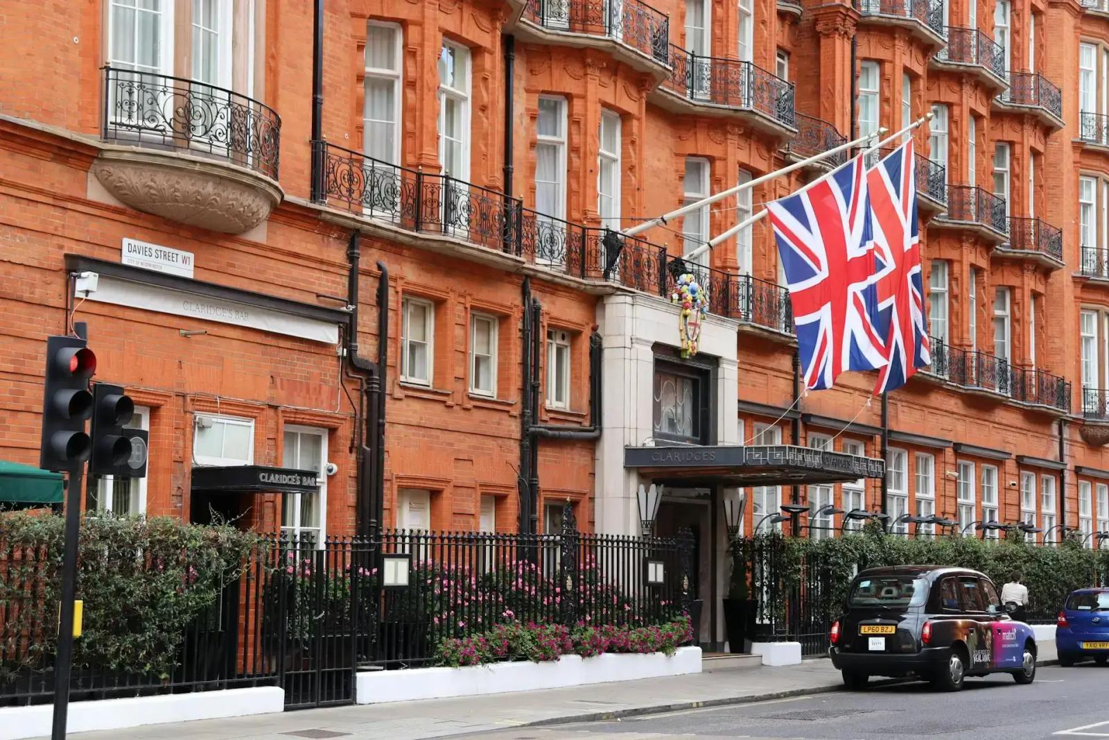 Claridges building in London with UK flags hanging outside