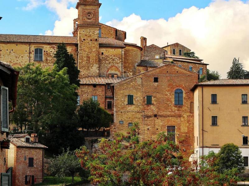 Medieval Italian architecture in Tuscany featuring traditional stone masonry and terracotta roofs
