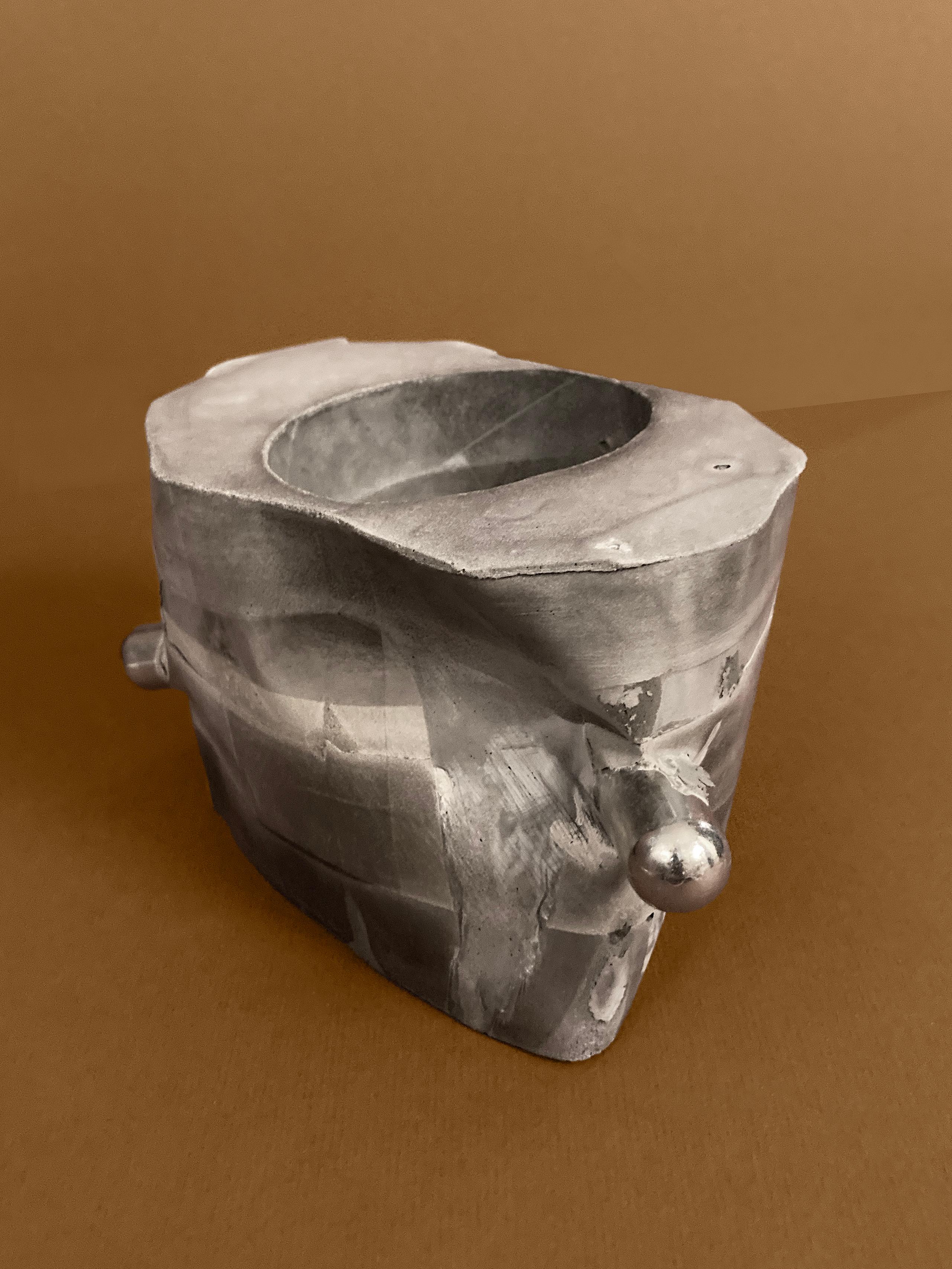 Right Angles — an octagonal concrete planter with two chrome rods, unplanted, view 4 of 5