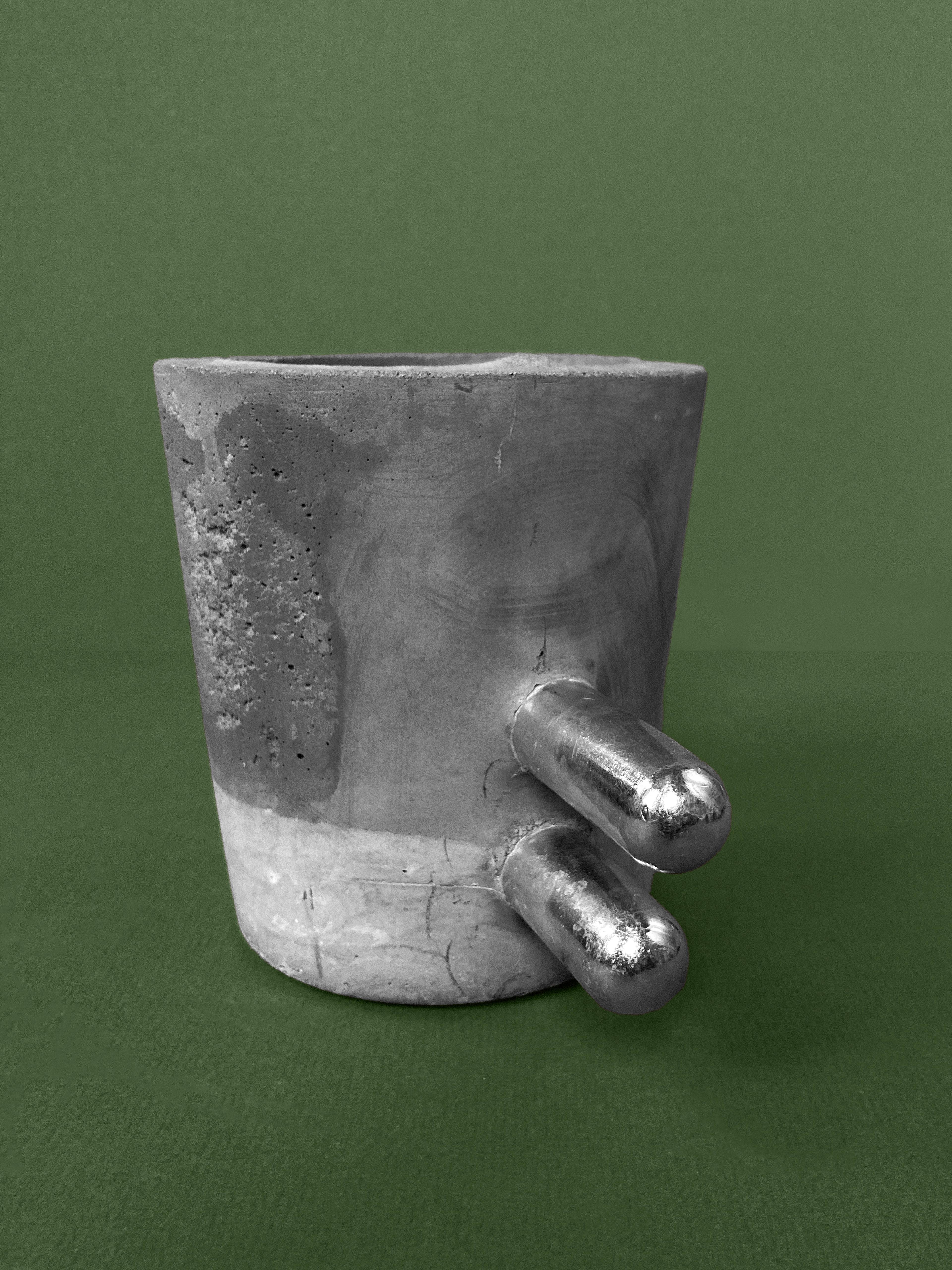 Make It Double — a concrete planter with two parallel chrome rods, unplanted, view 2 of 2